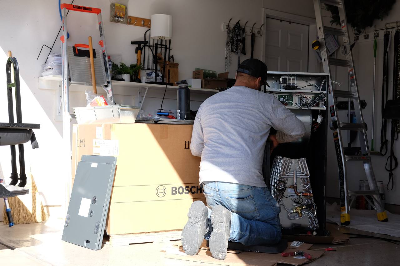 Joe assembling the Aspen air handler for horizontal left air output configuration