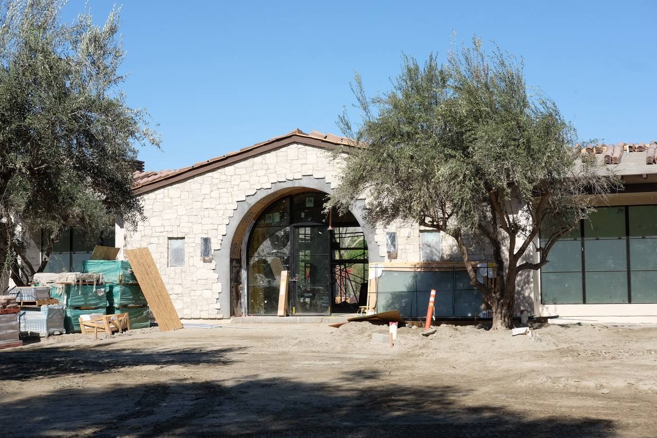 Stone entryway on a custom South La Quinta home during finish construction
