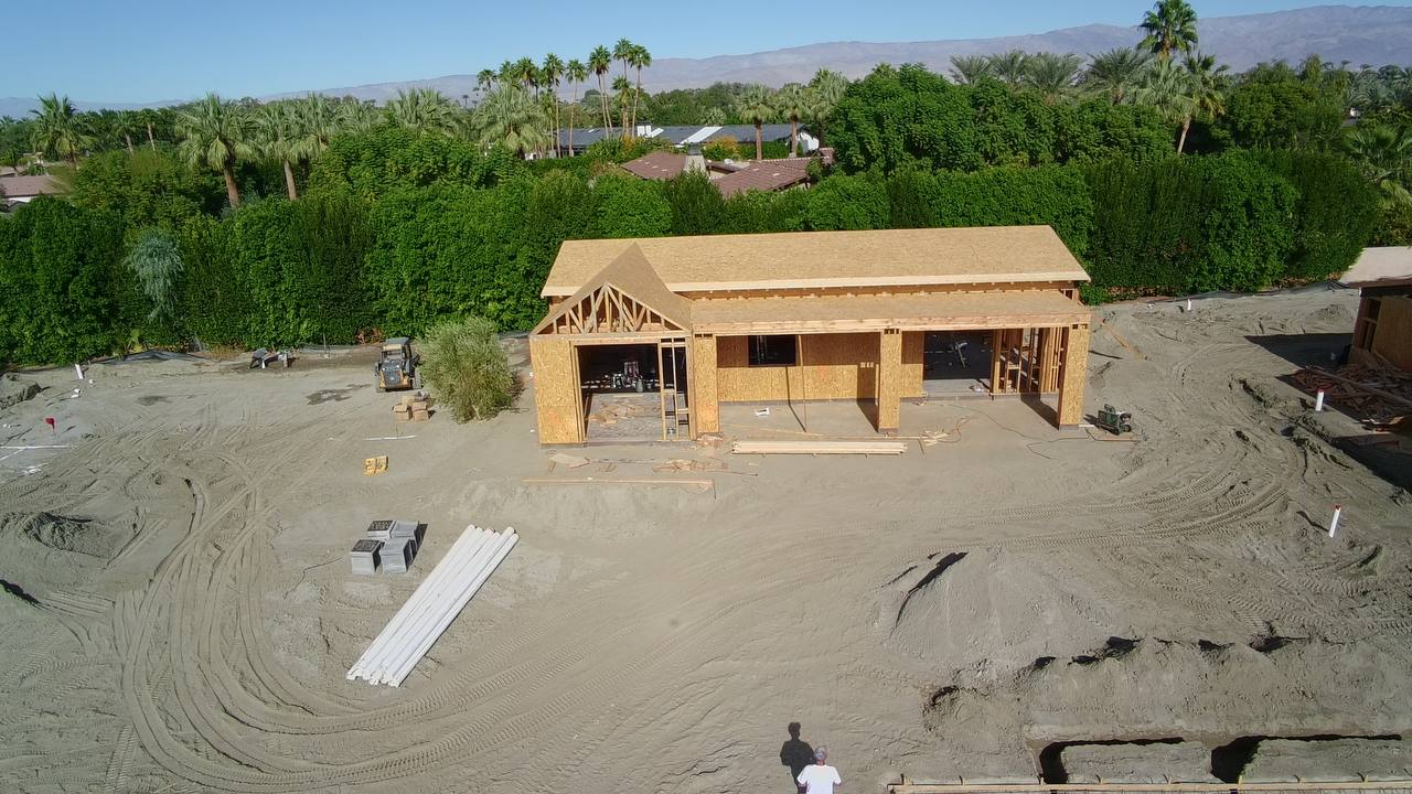 Aerial view of the barn and workout space during construction — South La Quinta