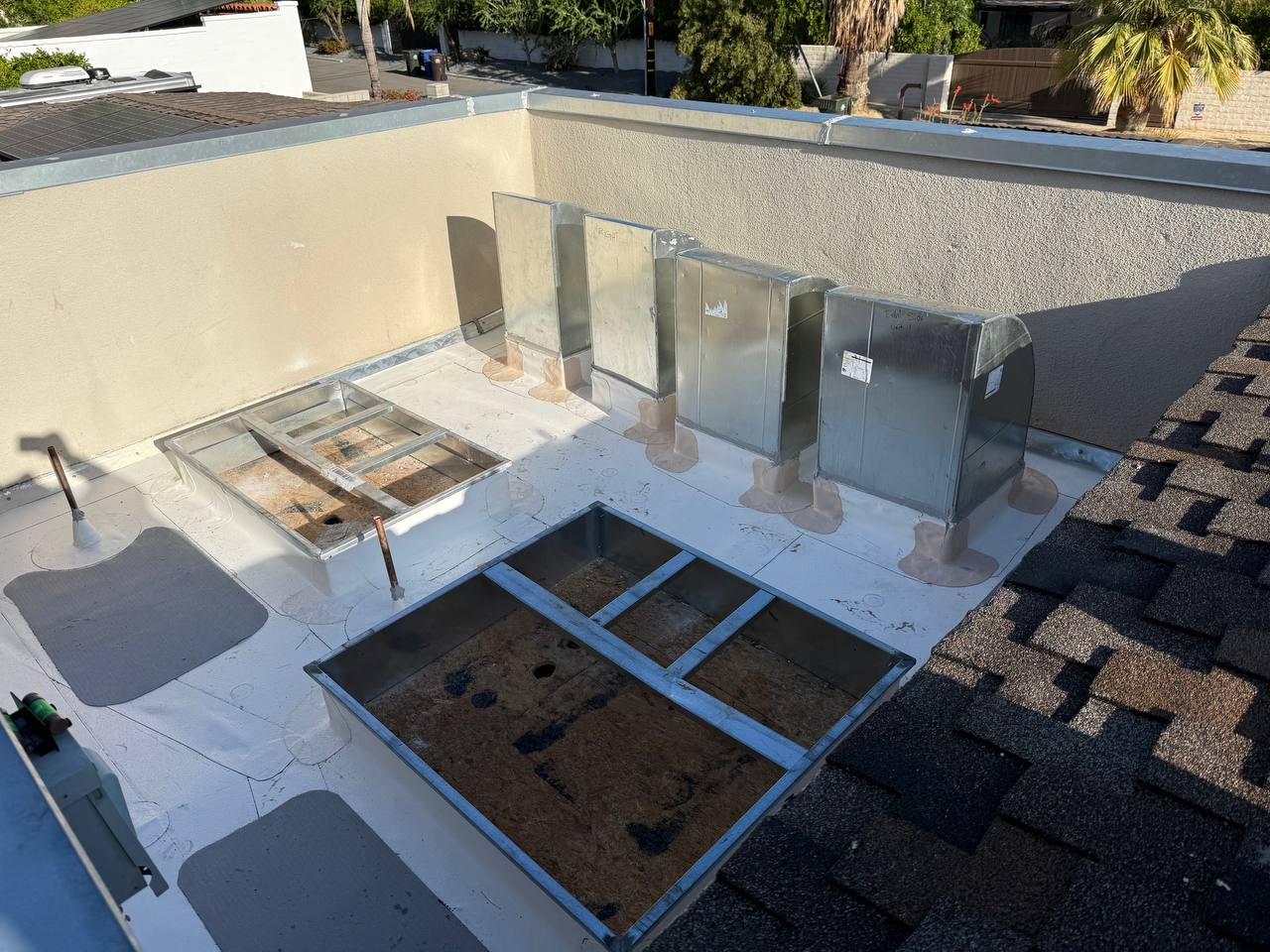 New unit curbs and plenum roof transitions installed on fresh PVC flat roof